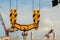 Construction site of football stadium . Crane hoist , hook , wire rope sling against the background blue sky, concept