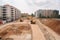 construction site with heavy machinery and materials, ready to build new building