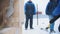 Construction site. A man hitting a wooden box with a hammer