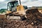 construction site with mini bulldozer pushing earth and leveling ground