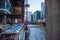 Construction site at new building in Chicago Loop along Wacker Dr, as seen from the Chicago River where boats compete for space