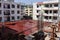 The construction site of a newly constructed apartment complex. Wooden pillar supports and waterproof roofs.