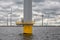 Construction site offshore windfarm near Dutch coast with cloudy sky