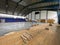 Construction site of sports hall, basketball court renovation, school gym indoor changing hardwood parquet flor and