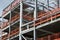 Construction site of steel framed development with orange fence