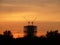 Construction site in sunset clouds