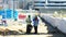 Construction site with workers using modern tools and cranes