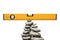 Construction Spirit Level on a Pile of Stones in Balance