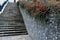 construction of a steep staircase by the stone wall car park with high