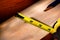 Construction Tape Measure on Carpentry Wood Board