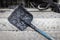 Construction tool for road works. Shovel for laying asphalt close-up. Asphalting of roads