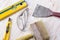 Construction tools: level, trowel, glasses, knife and brush