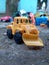 construction toys yellow bulldozer selctive focus