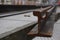 Construction of tracks for trams in the old town. rusty rails close-up, city and construction workers in yellow vests are blurred