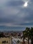 Construction at viewpoint plattform build at parc guell up hill with weather dark sky grey clouds view over Barcelona