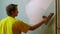 Construction Worker Applying Plaster on a Drywall