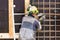 Construction worker bending - wiring concrete steel bars with a machine, outdoors in Nuuk.