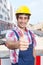 Construction worker with black hair showing thumb up