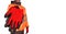 A construction worker in a bright orange hi-viz coat giving red  safety gloves to the viewers isolated on white background. Safety