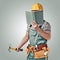 Construction worker, builder with a tool belt and book