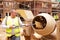 Construction Worker On Building Site Mixing Cement