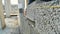 Construction worker builds brick wall, closeup view at construction site