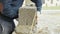 Construction worker builds brick wall, closeup view at construction site