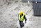 Construction worker carrying armature