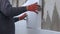 Construction worker covering house wall with adhesive cement glue berore installing styrofoam insulation sheets for thermal protec