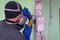 Construction worker cutting concrete wall by using electric cutter