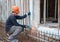 Construction worker cutting steel rods