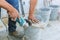 A construction worker cutting a tile using grinder