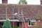 Construction worker erecting scaffolding.