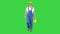 Construction worker in hard hat holding plastic canister and walking on a Green Screen, Chroma Key.