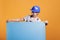 Construction worker holding empty cardboard sign