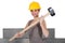 Construction worker holding mallet