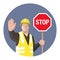 Construction worker holding STOP sign in his hand