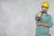 The construction worker holds an electric screwdriver in his hand, various situations