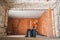 Construction Worker Inside Newly Rebuilt Building Interior