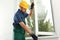 Construction worker installing new window