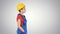 Construction worker lady walking emotionless on gradient background.