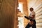 Construction worker with laptop providing house examination