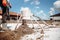 Construction worker laying sand and cement, installing screed floor. Sand and cement floor screed