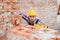 Construction worker man in work clothes and a construction helmet. Portrait of positive male builder in hardhat working