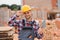 Construction worker man in work clothes and a construction helmet. Portrait of positive male builder in hardhat working