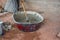 Construction worker manually mixing concrete in mixer tray