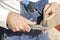 Construction worker measures the thickness of the floor panel by means of the caliper.