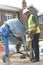 Construction Worker Mixing Cement