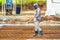 Construction worker performs the construction of the factory shed