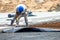 Construction worker performs the construction of the factory shed